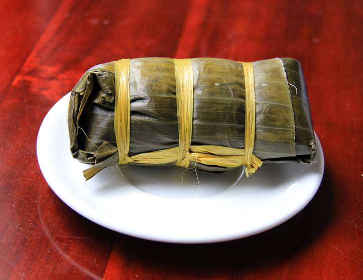 Banh Tet in banana leaf wrapper.
