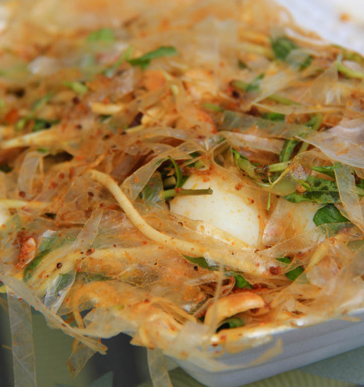 Takeout container of rice paper salad or banh trang tron